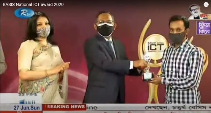 Receiving the BASIS National ICT Award 2020 trophy on stage