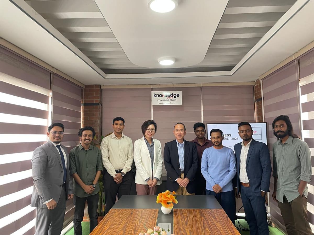 Group photo after a meeting with Nippon Koei