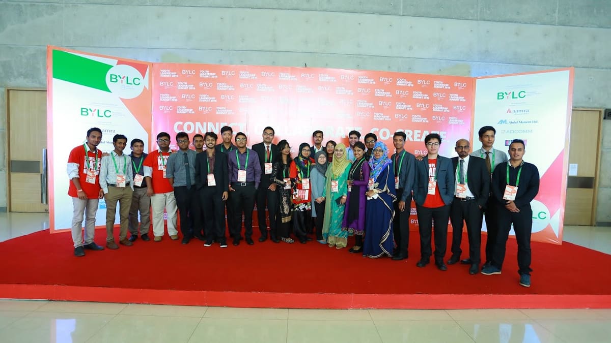 Group photo on stage at the Bangladesh Youth Leadership Center summit